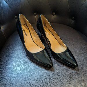 Classic and confident black patent heels